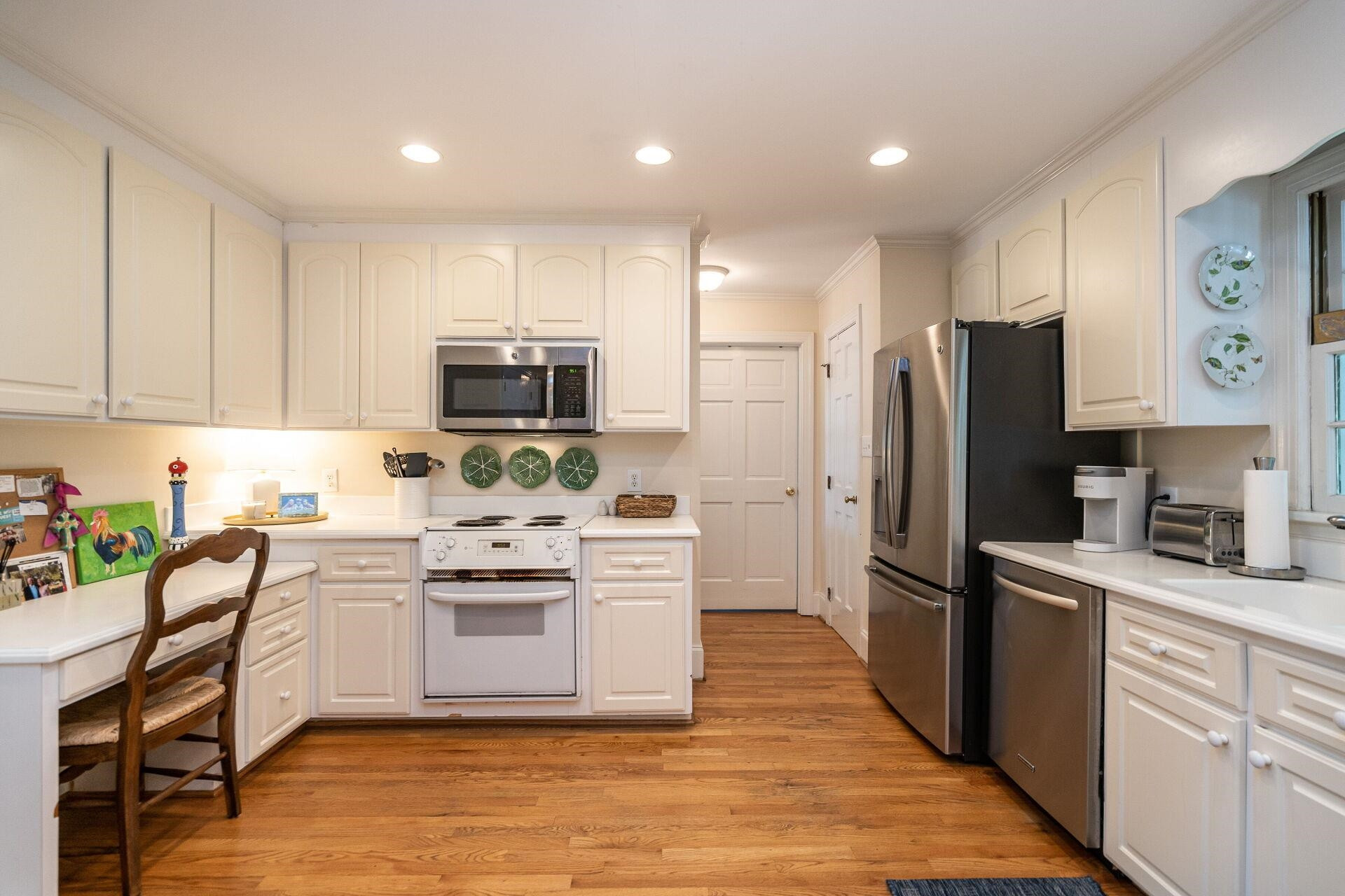 2834 Exeter Circle Raleigh, NC 27608 - Photo 11 of 30 a kitchen with stainless steel appliances a refrigerator stove microwave and sink