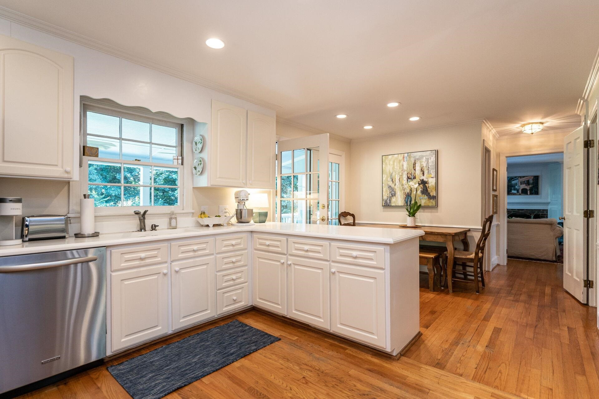 2834 Exeter Circle Raleigh, NC 27608 - Photo 12 of 30 a large kitchen with cabinets a sink and appliances in it
