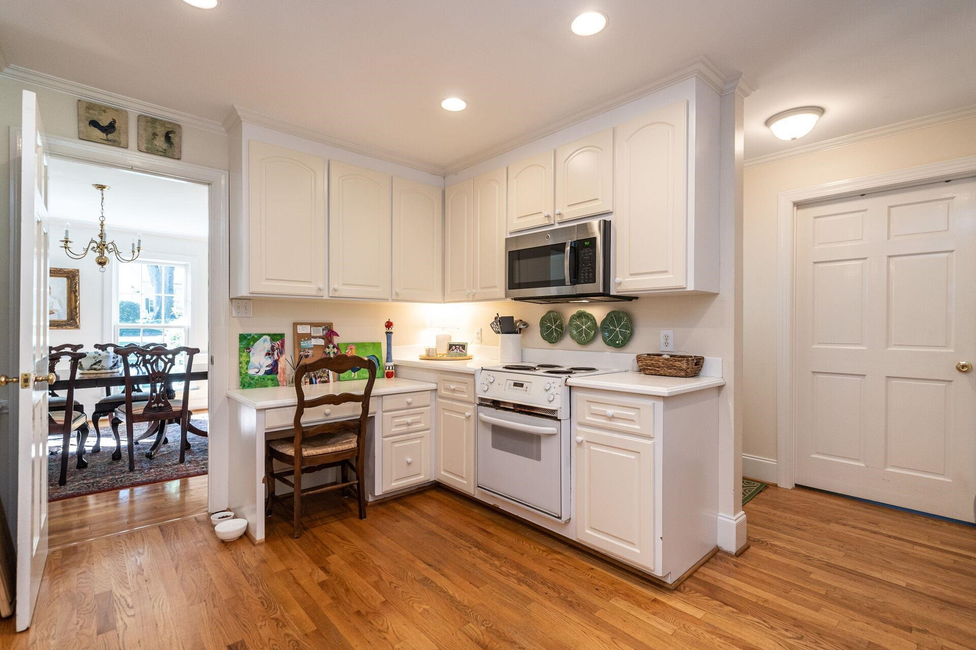 2834 Exeter Circle Raleigh, NC 27608 - Photo 13 of 30 a kitchen with appliances a sink and cabinets