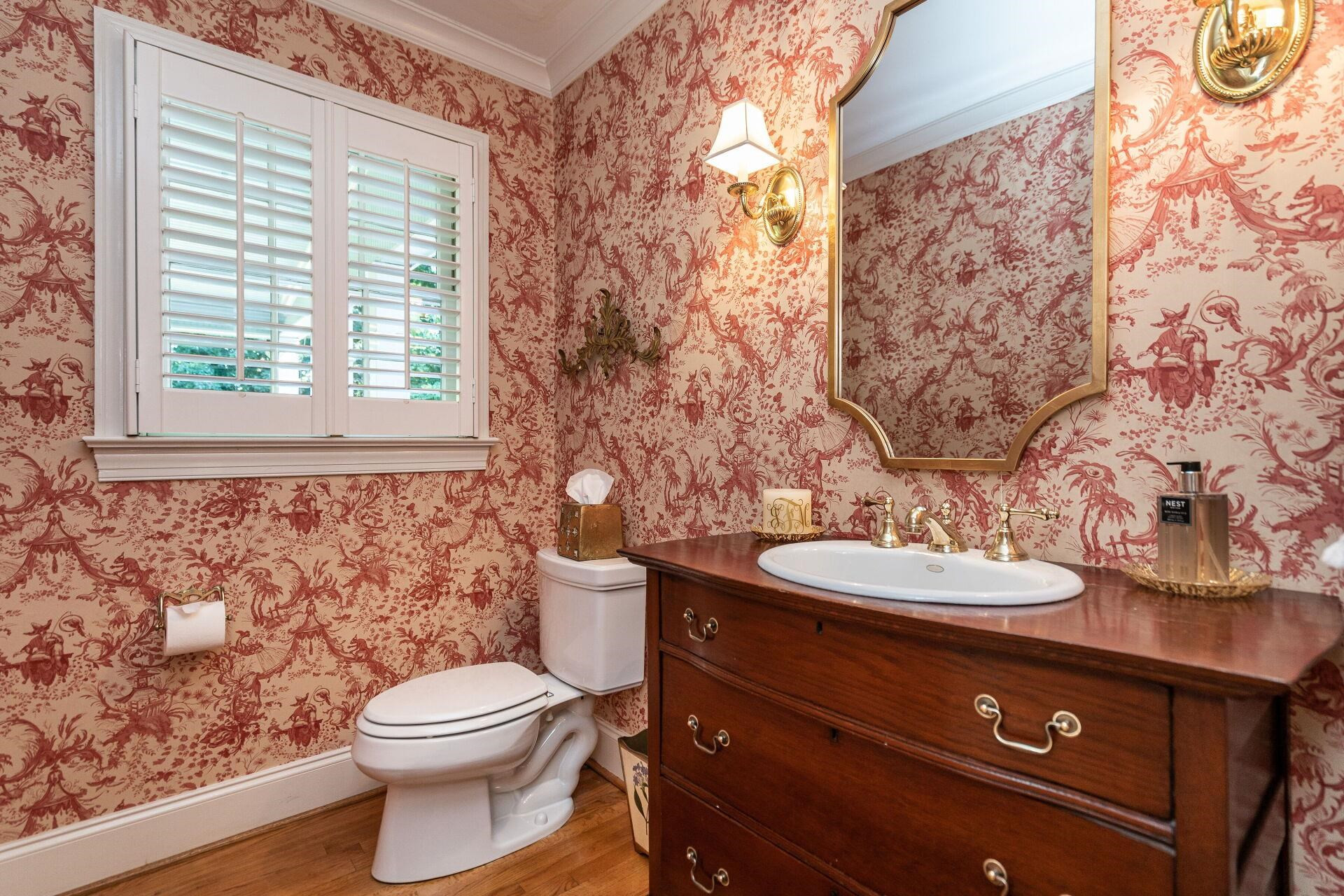 2834 Exeter Circle Raleigh, NC 27608 - Photo 14 of 30 a bathroom with a toilet a sink and a window