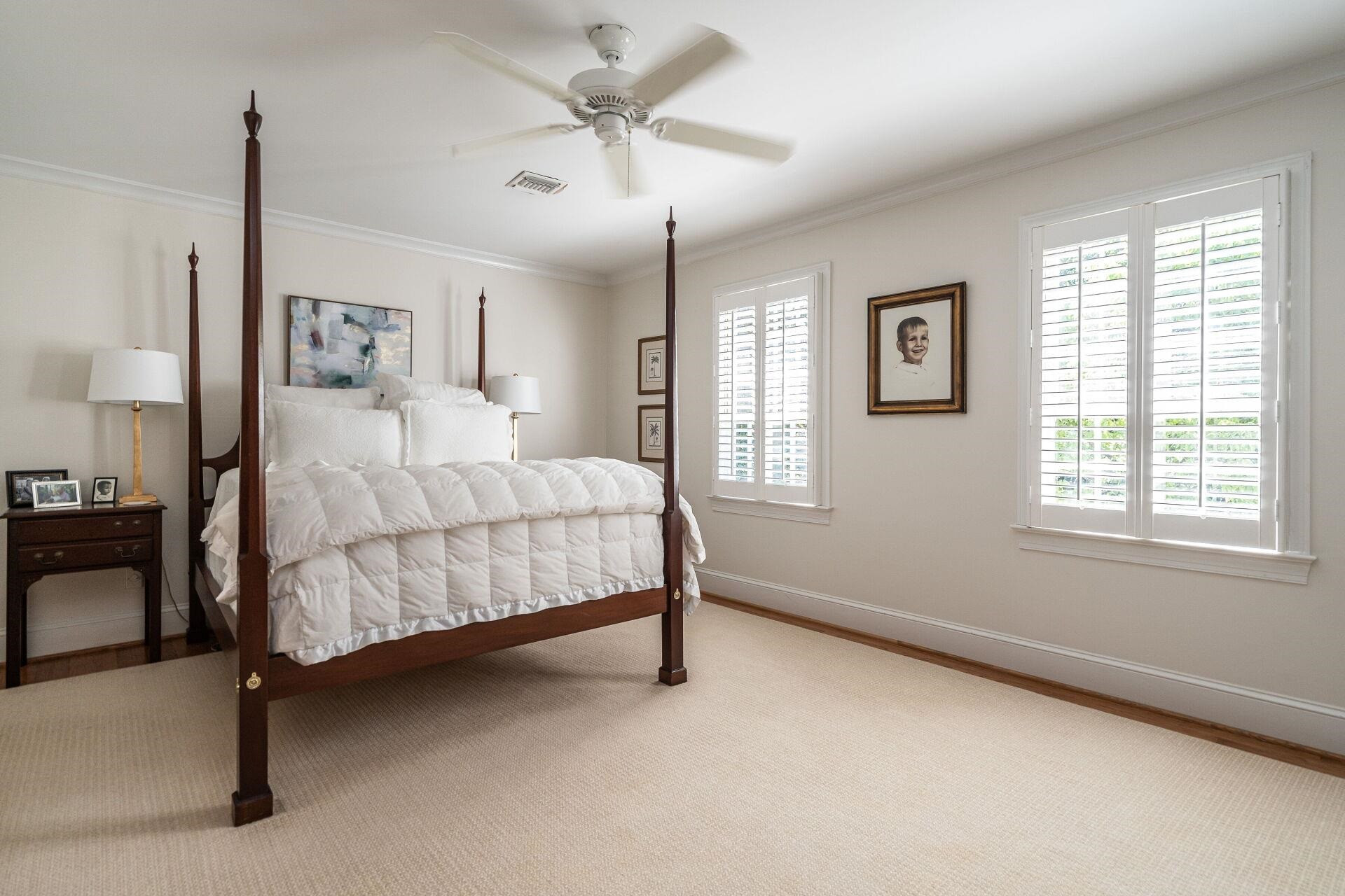 2834 Exeter Circle Raleigh, NC 27608 - Photo 15 of 30 a bedroom with a bed chandelier and window