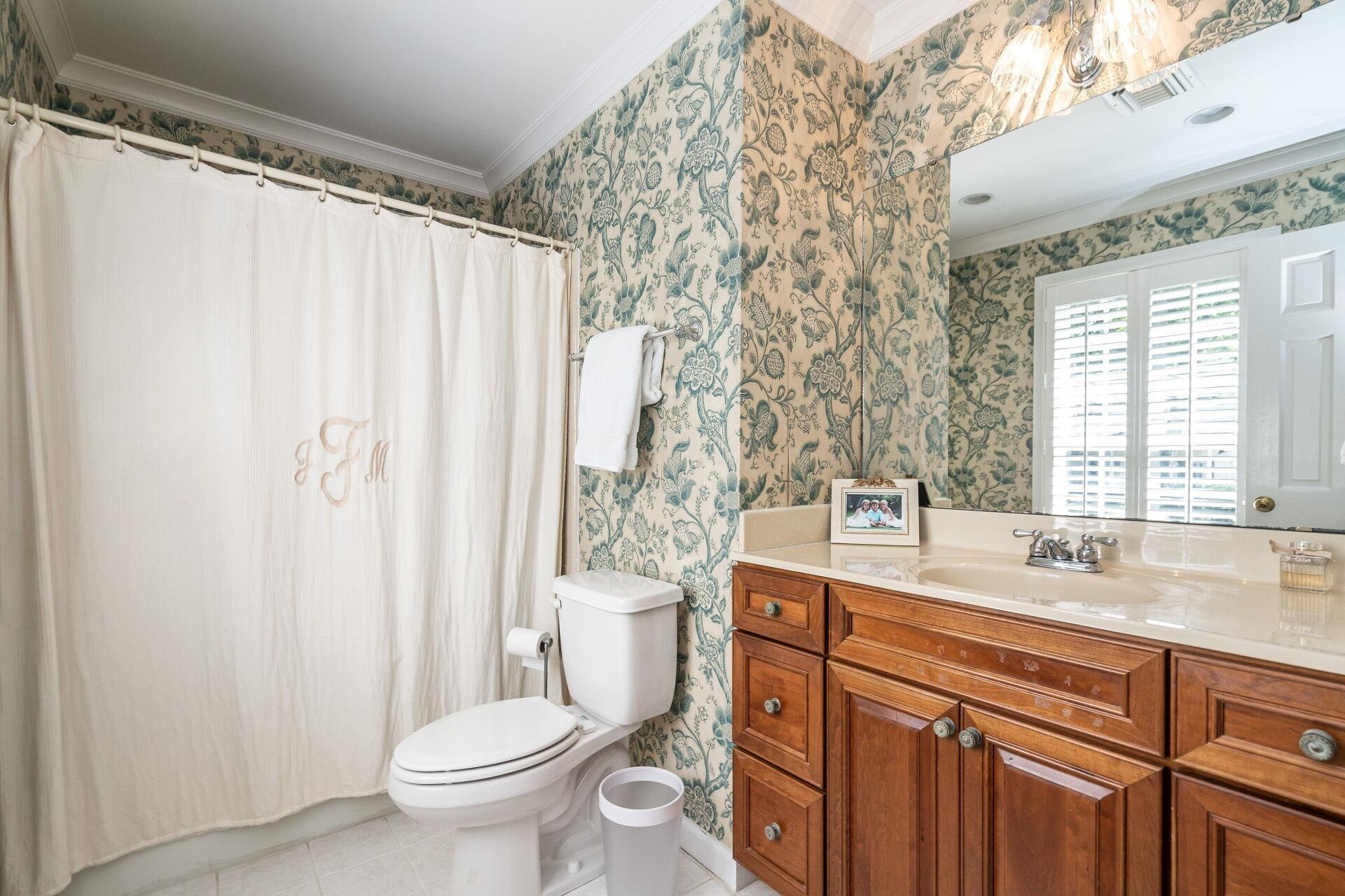 2834 Exeter Circle Raleigh, NC 27608 - Photo 16 of 30 a bathroom with a granite countertop sink toilet and shower
