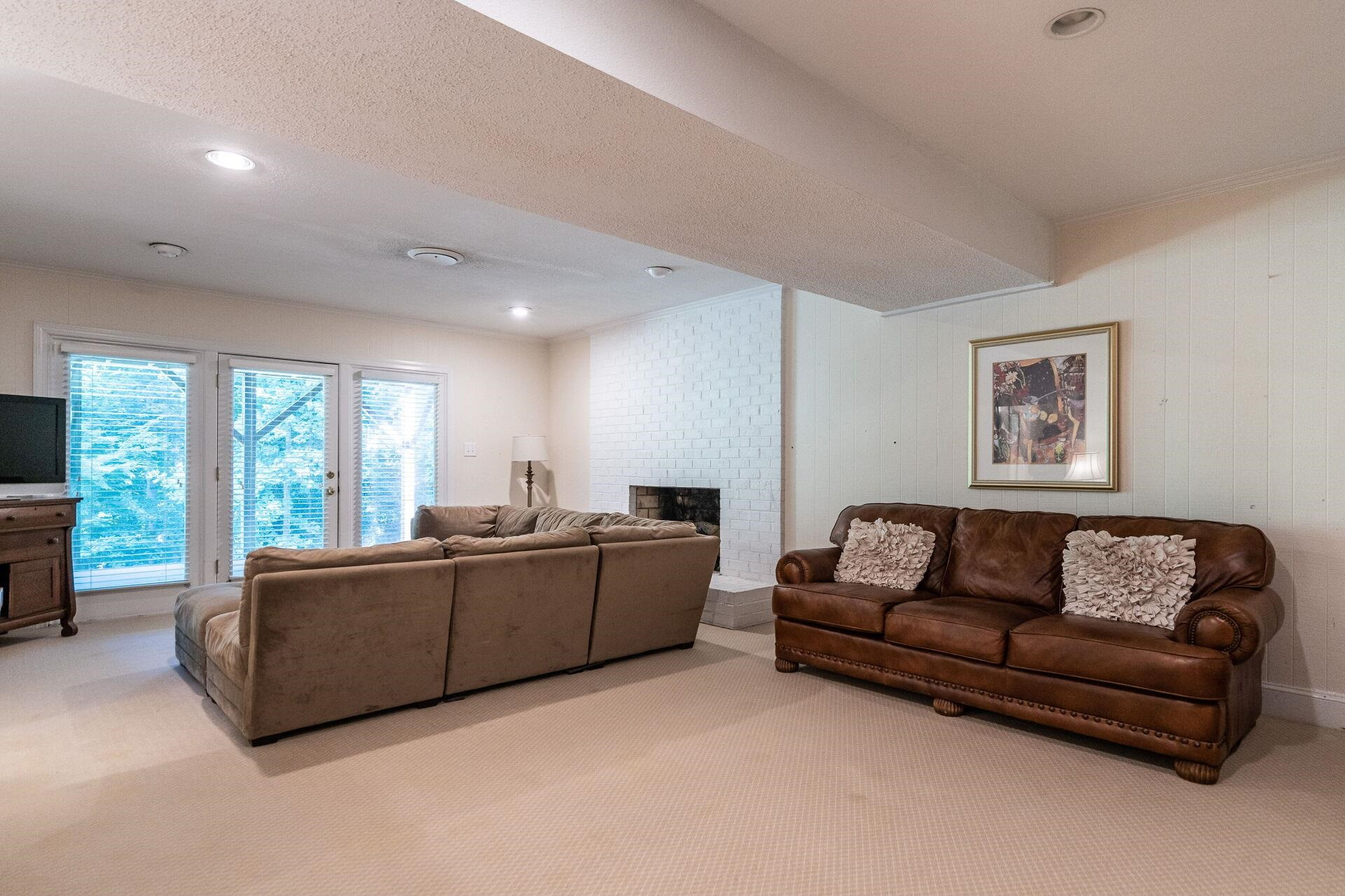 2834 Exeter Circle Raleigh, NC 27608 - Photo 20 of 30 a living room with furniture and a flat screen tv