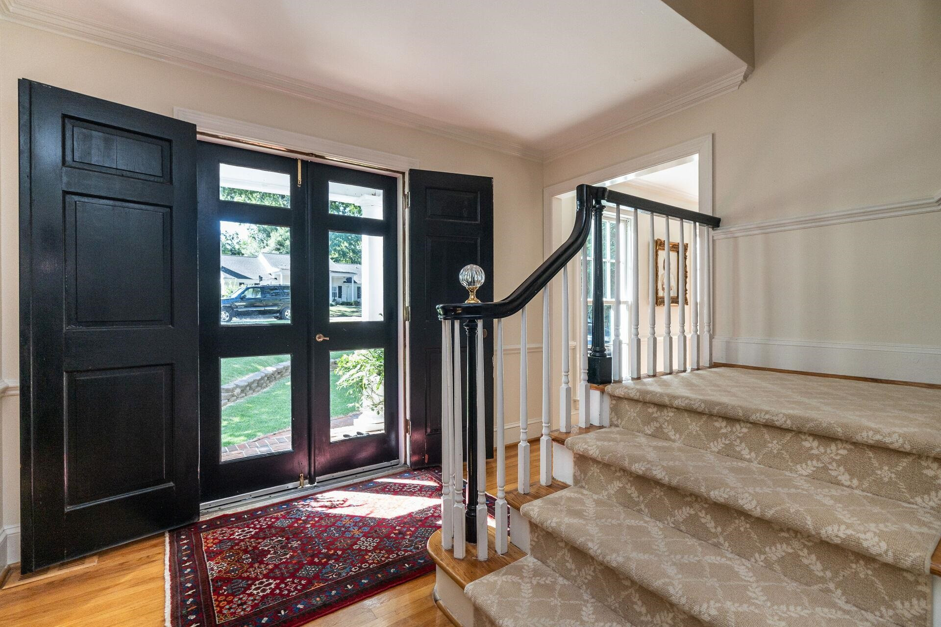 2834 Exeter Circle Raleigh, NC 27608 - Photo 4 of 30 a view of an entryway with a floor to ceiling window