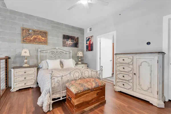 a bedroom with a bed and a dresser