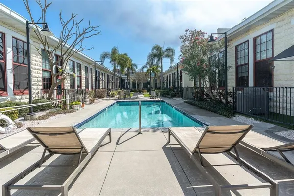 a view of swimming pool with outdoor seating