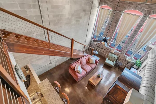 a view of living room with furniture and a rug
