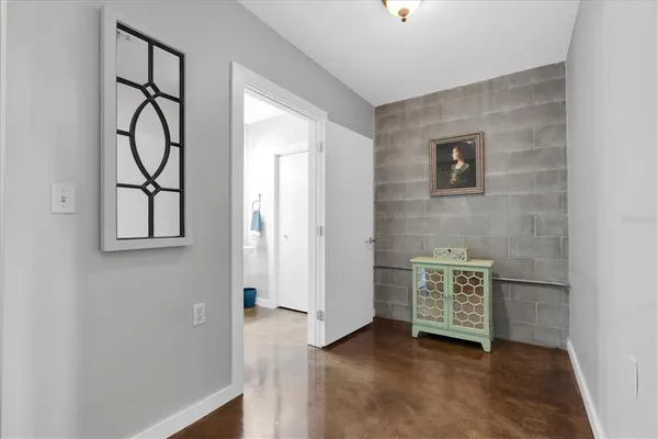a view of an entryway with wooden floor