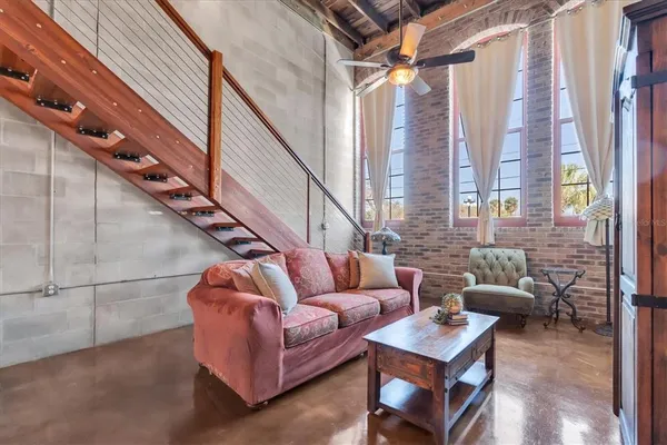 a living room with furniture and a window