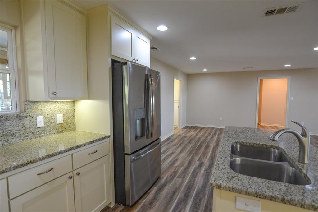 322 Hcr 2320 Abbott, TX 76621 - Photo 16 of 40 a kitchen with kitchen island granite countertop a sink stainless steel appliances and cabinets