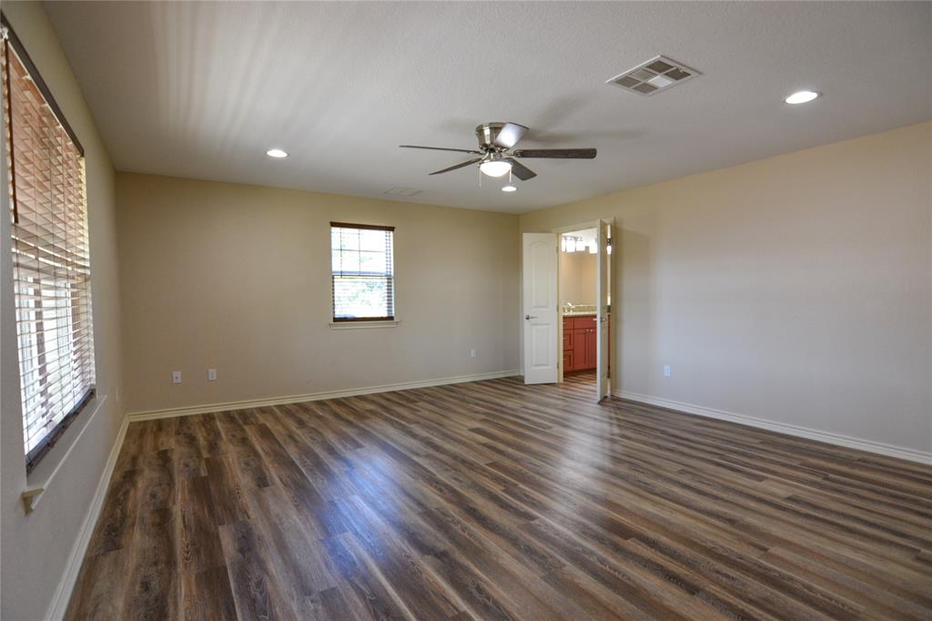 322 Hcr 2320 Abbott, TX 76621 - Photo 20 of 40 an empty room with wooden floor and windows