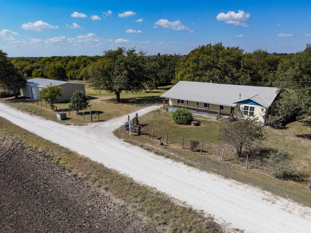 322 Hcr 2320 Abbott, TX 76621 - Photo 2 of 40 a view of a patio with a table and chairs under an umbrella