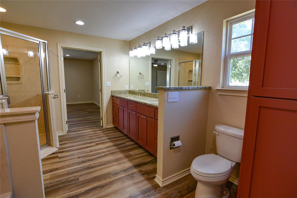 322 Hcr 2320 Abbott, TX 76621 - Photo 23 of 40 a bathroom with a sink a toilet a mirror and window