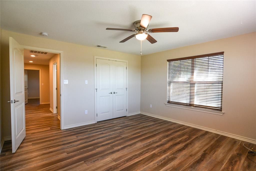 322 Hcr 2320 Abbott, TX 76621 - Photo 27 of 40 a view of an empty room with wooden floor and a window