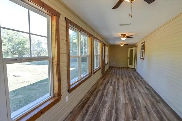 a view of hallway with a large window