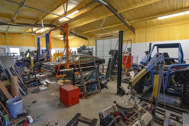 a view of a storage room with racks on the wall