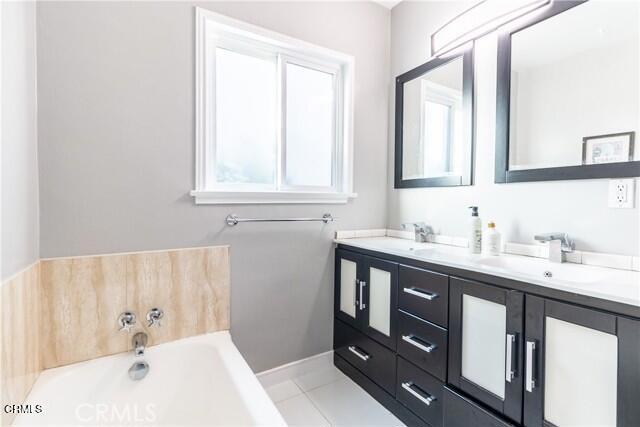 412 South Kenneth Road Burbank, CA 91501 - Photo 15 of 24 a bathroom with a tub sink and mirror