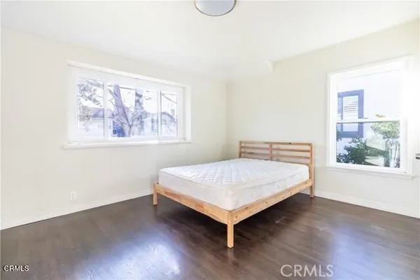 a room with a bed and a window