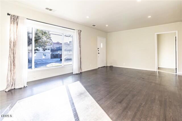 412 South Kenneth Road Burbank, CA 91501 - Photo 3 of 24 a view of a big room with wooden floor and doors