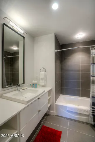 a bathroom with a bathtub and a sink