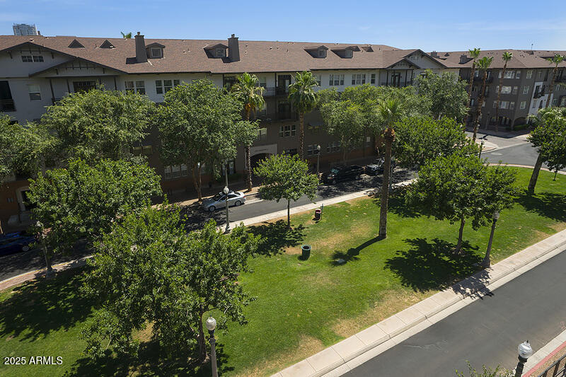 100 West Portland Street, Unit 506 Phoenix, AZ 85003 - Photo 14 of 25 an aerial view of a house with a garden and large trees