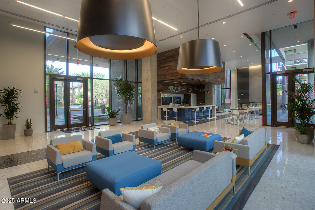 100 West Portland Street, Unit 506 Phoenix, AZ 85003 - Photo 16 of 25 a living room with furniture a lamp and a large window