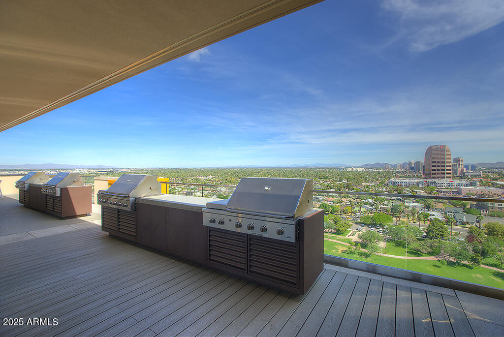 100 West Portland Street, Unit 506 Phoenix, AZ 85003 - Photo 23 of 25 a view of a balcony with two chairs and a table