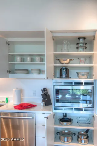 a cabinet with a stove and cabinets