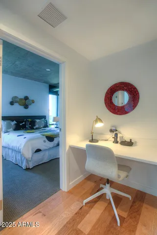 a bedroom with a bed and dresser