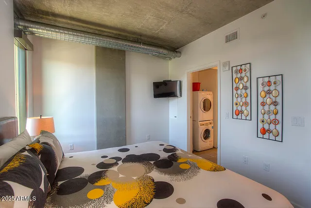 a bedroom with a bed and teddy