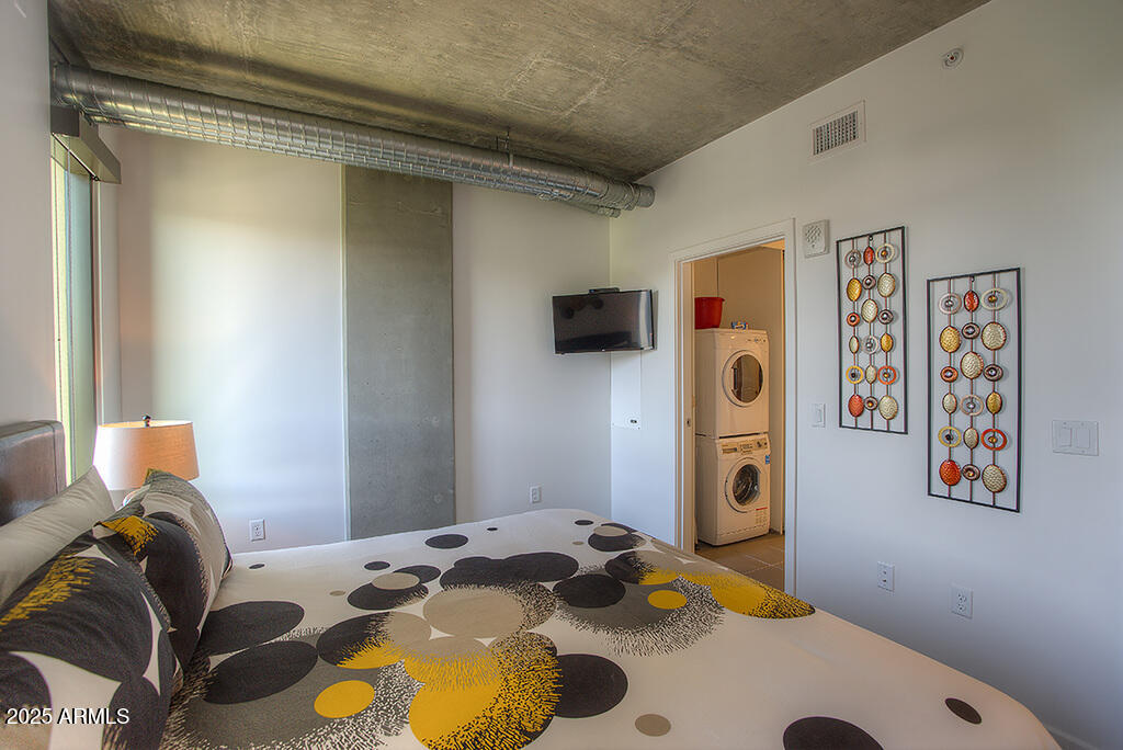 100 West Portland Street, Unit 506 Phoenix, AZ 85003 - Photo 10 of 25 a bedroom with a bed and teddy