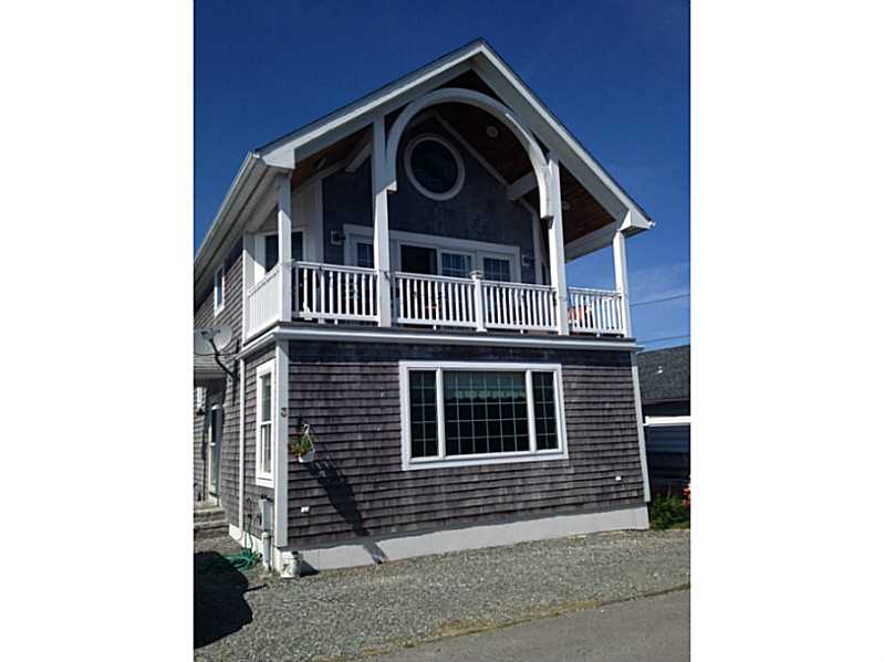 Exterior Front. Steps to private beach. 2beds,2 baths, custom built in 2002 with top of the line finish work & construction