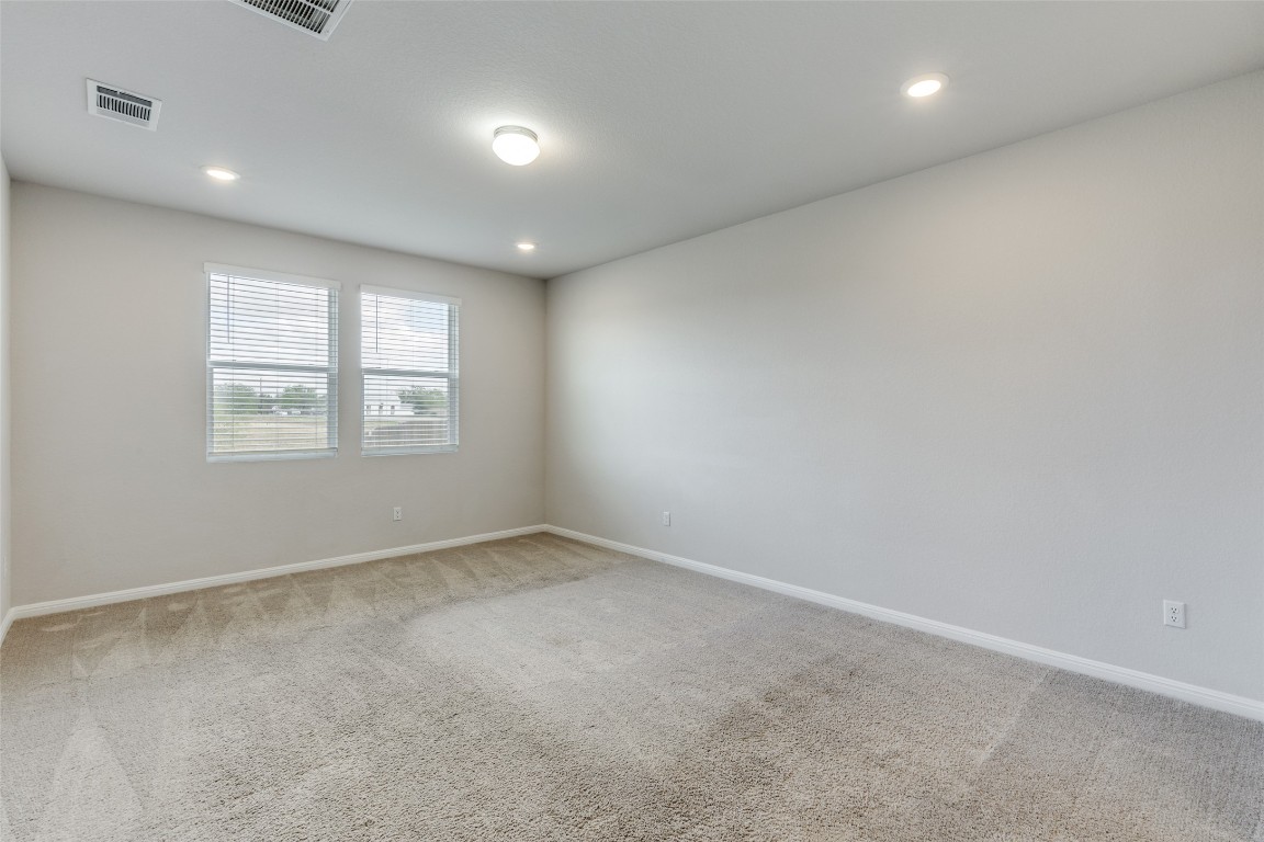 12912 Cerro Castellan Trace Manor, TX 78653 - Photo 22 of 36 an empty room with windows