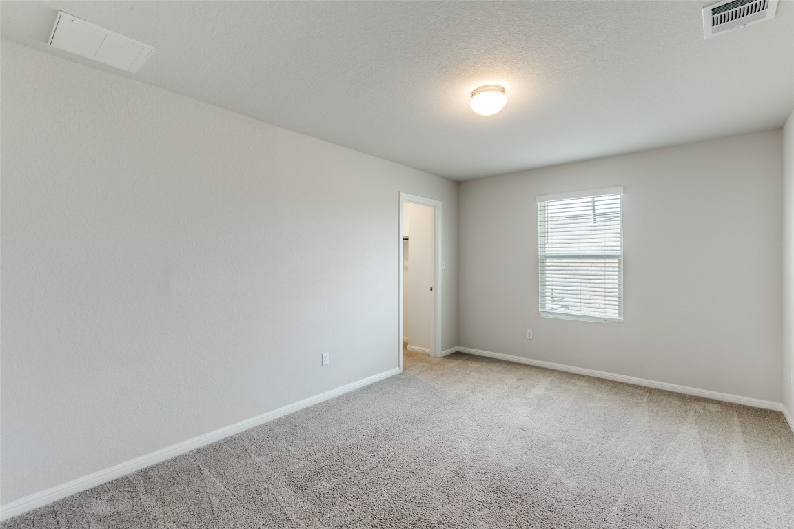 12912 Cerro Castellan Trace Manor, TX 78653 - Photo 24 of 36 a view of an empty room with a window