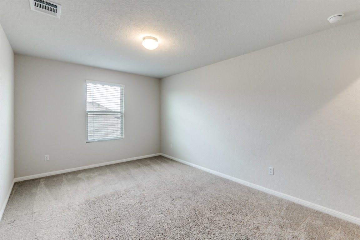 12912 Cerro Castellan Trace Manor, TX 78653 - Photo 25 of 36 an empty room with a window