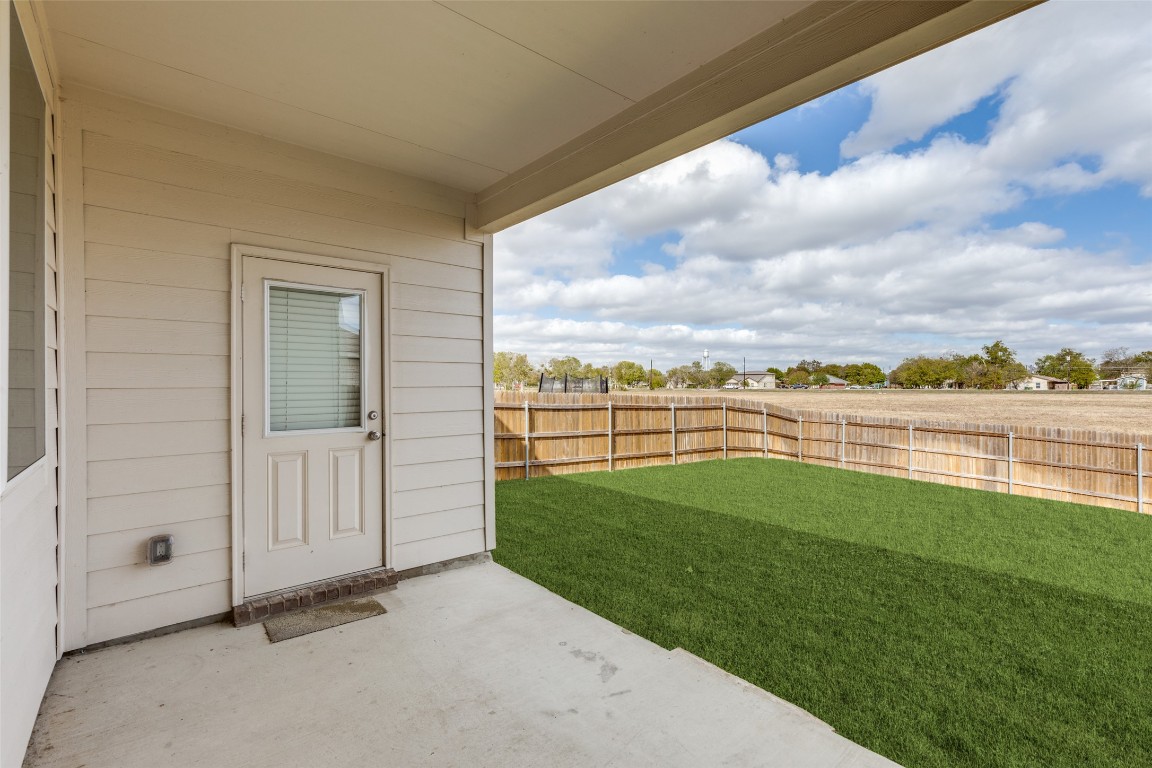 12912 Cerro Castellan Trace Manor, TX 78653 - Photo 31 of 36 a view of a garden and lake
