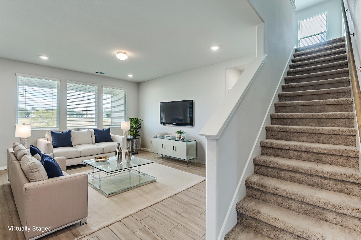 12912 Cerro Castellan Trace Manor, TX 78653 - Photo 7 of 36 a living room with furniture and a flat screen tv