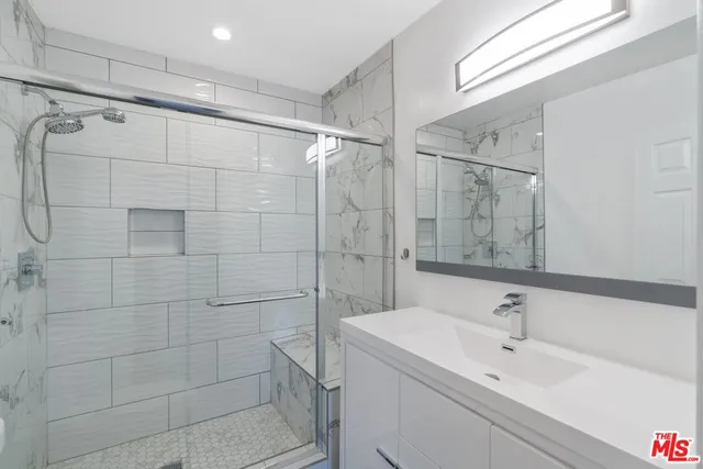 a view of room with window and wooden floor