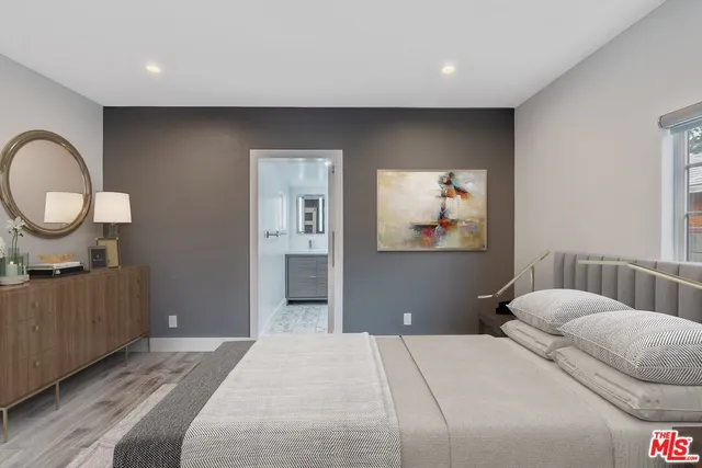 a bathroom with a sink a mirror and a bathtub