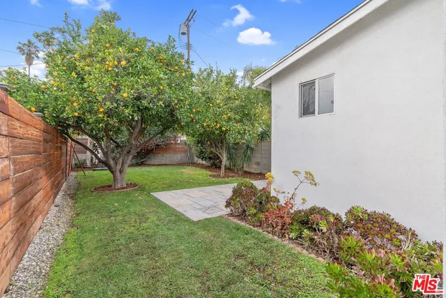 a view of a backyard of the house