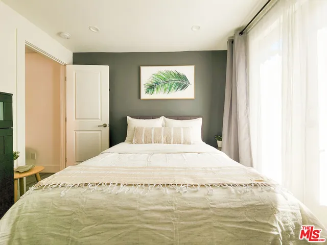 a living room with a chair and a table