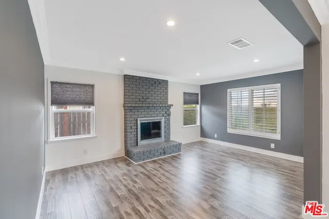 a living room with furniture couches and a fireplace