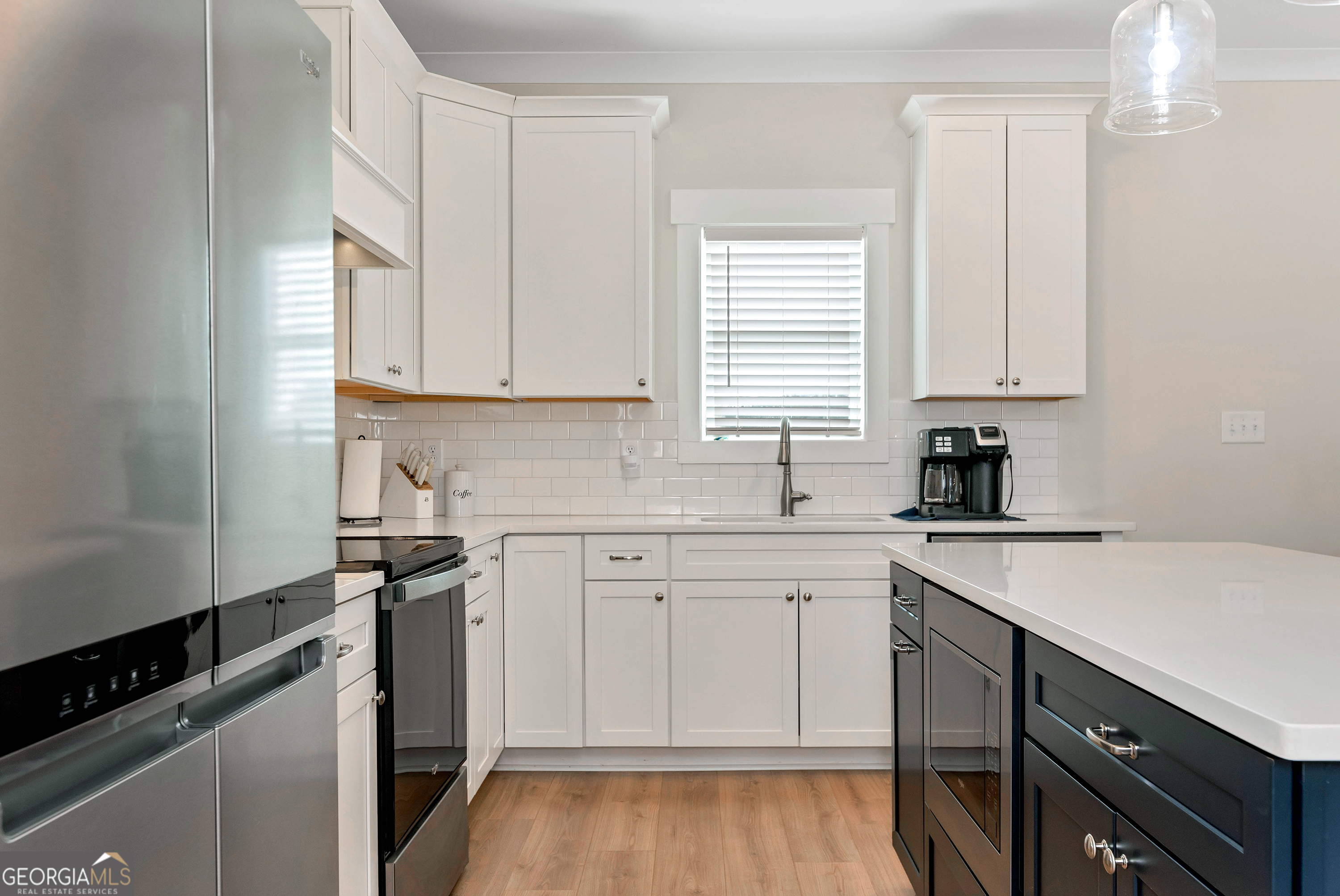 1350-c O Draper Road Comer, GA 30629 - Photo 11 of 40 a kitchen with a sink window and cabinets