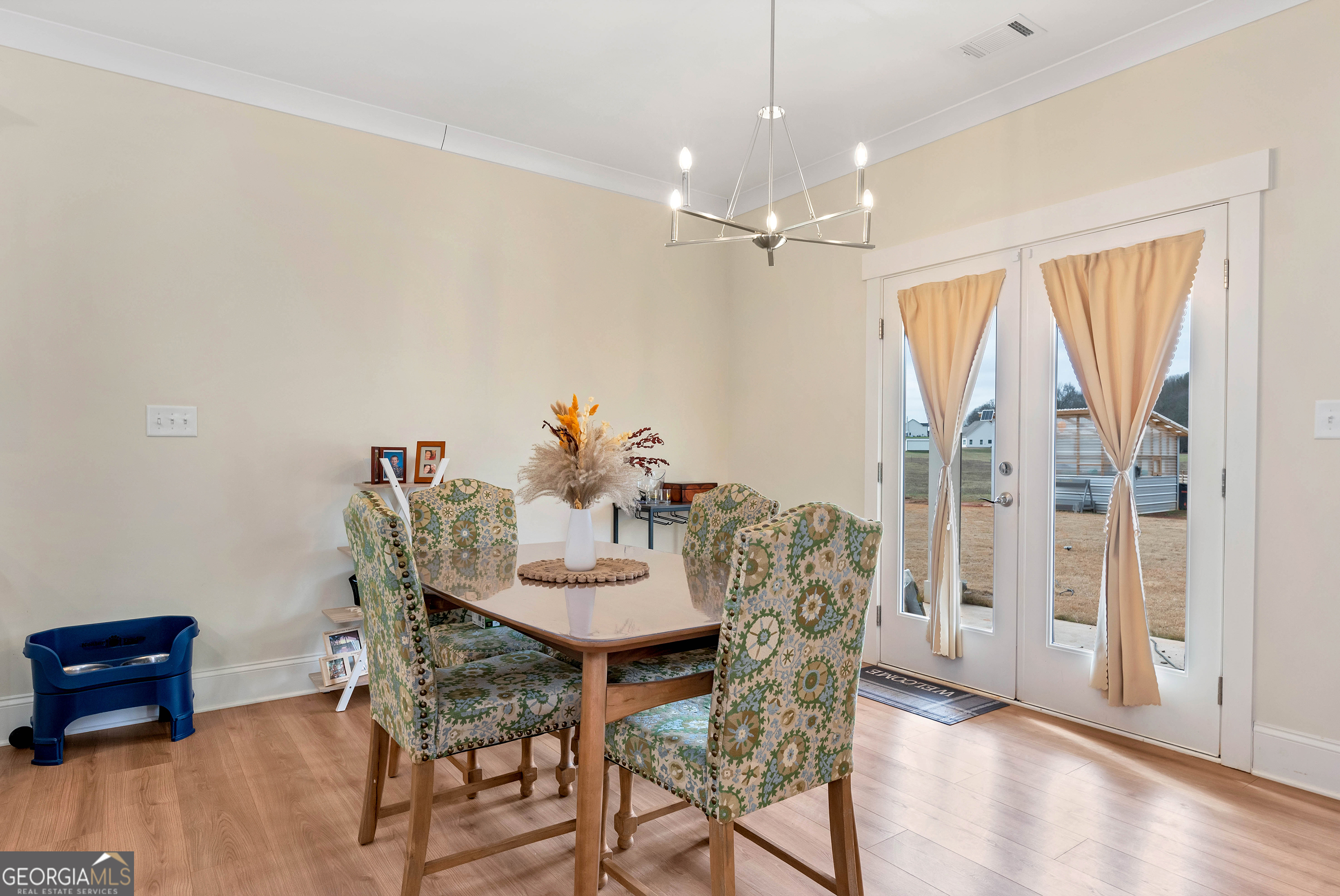 1350-c O Draper Road Comer, GA 30629 - Photo 12 of 40 a view of a dining room with furniture and wooden floor