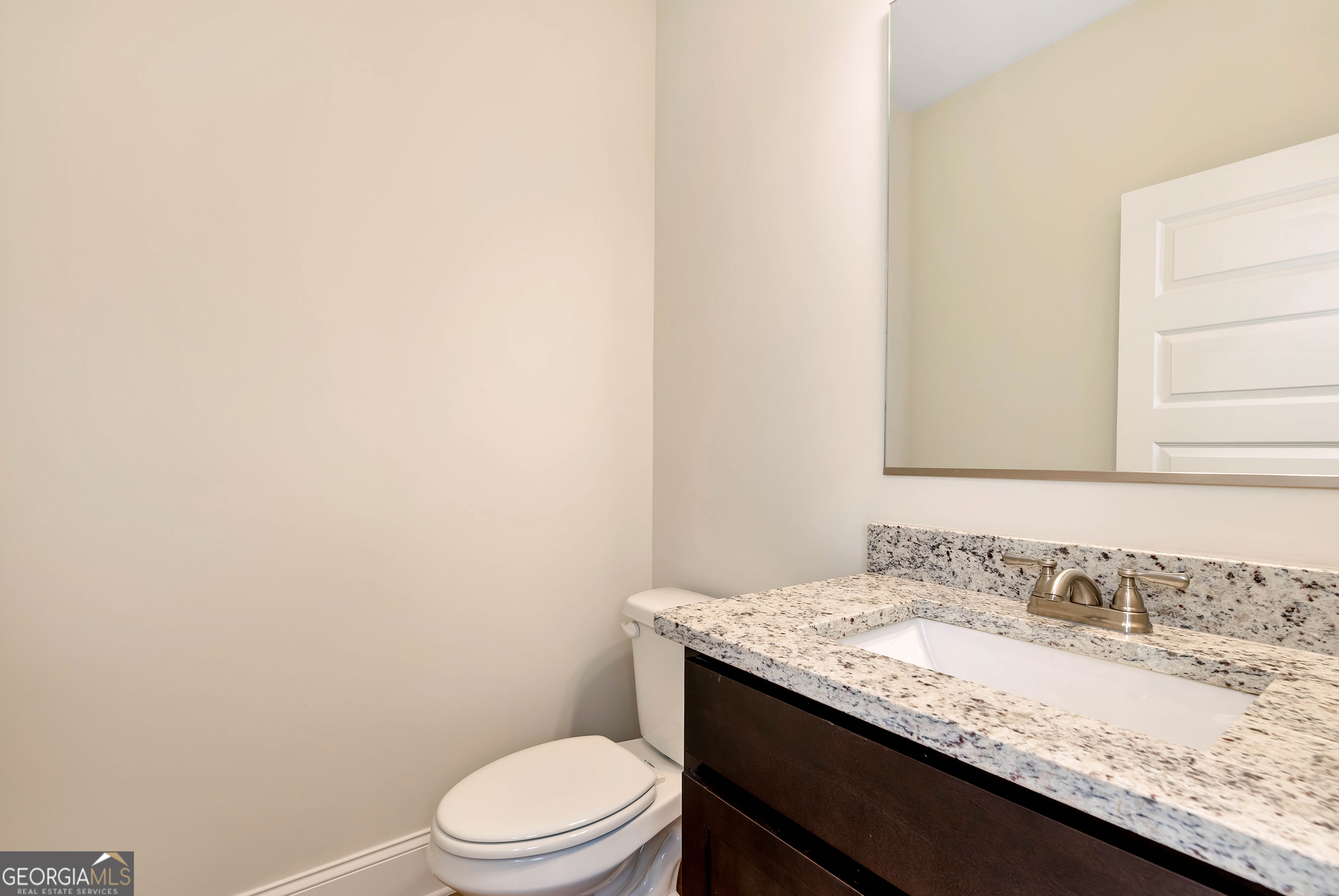 1350-c O Draper Road Comer, GA 30629 - Photo 17 of 40 a bathroom with a granite countertop sink toilet and mirror
