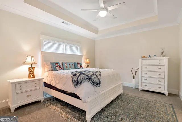 a bedroom with a bed and a dresser