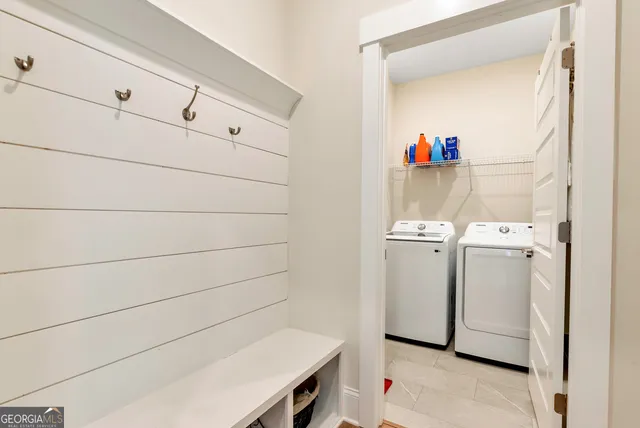 a utility room with dryer and washer