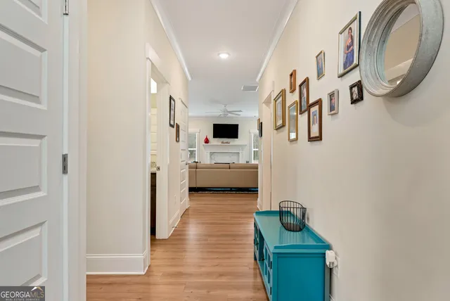 a view of a hallway with washer and dryer