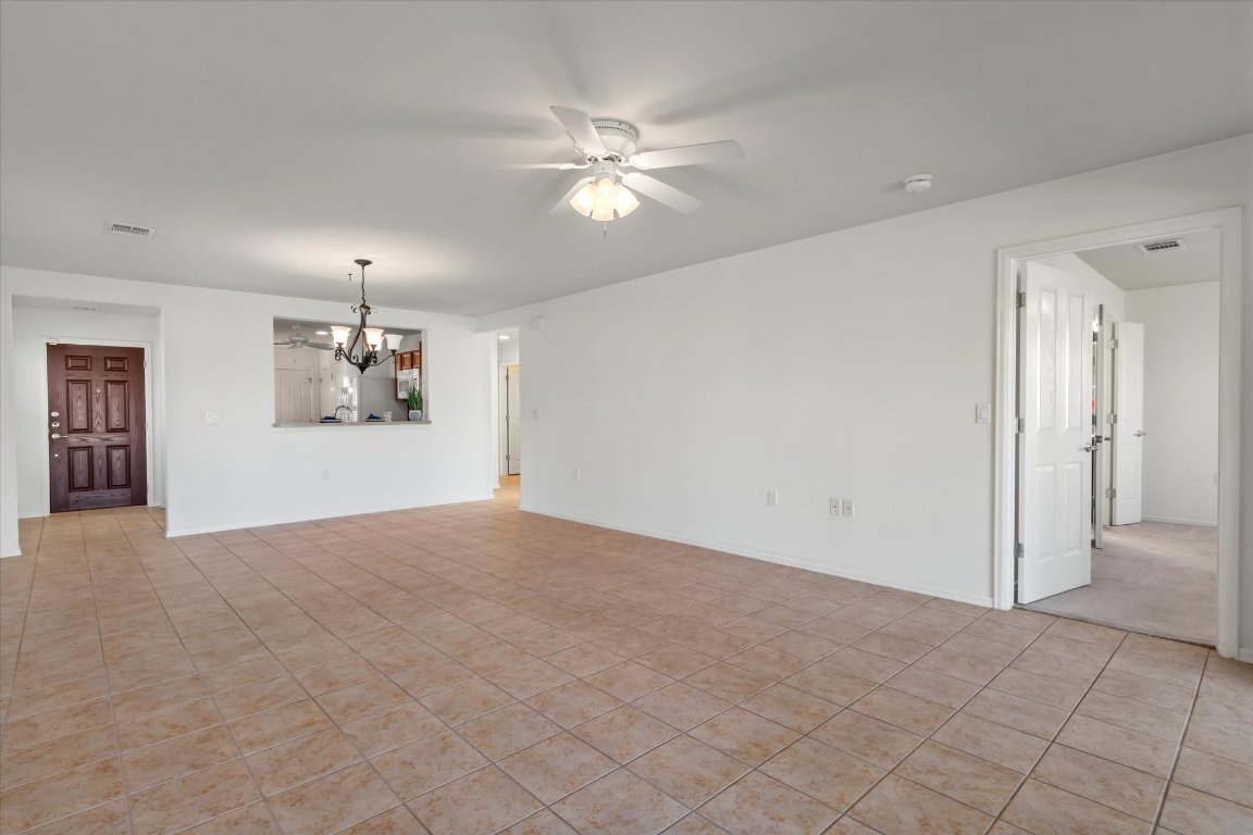 325 Barrington Farm Court Georgetown, TX 78633 - Photo 13 of 40 a view of a livingroom with a ceiling fan and window