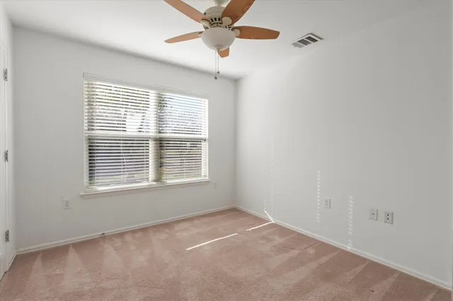 an empty room with fan